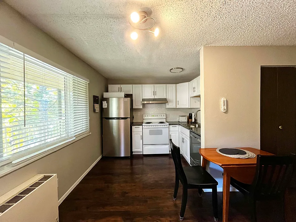Renovated kitchen, well-equipped with new appliances- fridge, dishwasher, microwave, toaster, blender, coffee maker, dinnerware & utensils. Dining table and chairs included