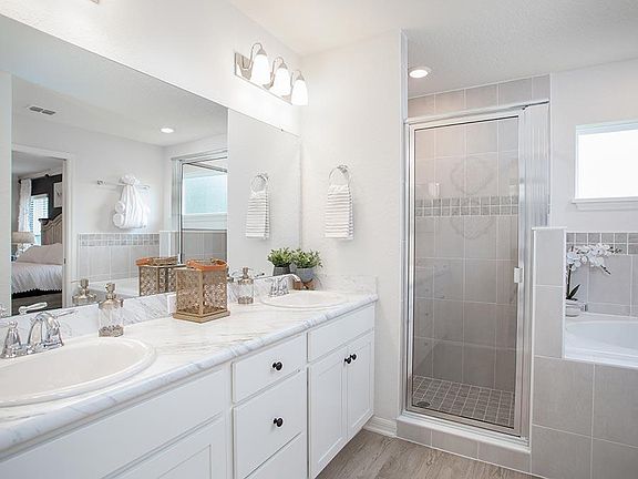 Private en-suite owner s bath - New home for sale in Ocala, FL. - Photo showcases a model home with