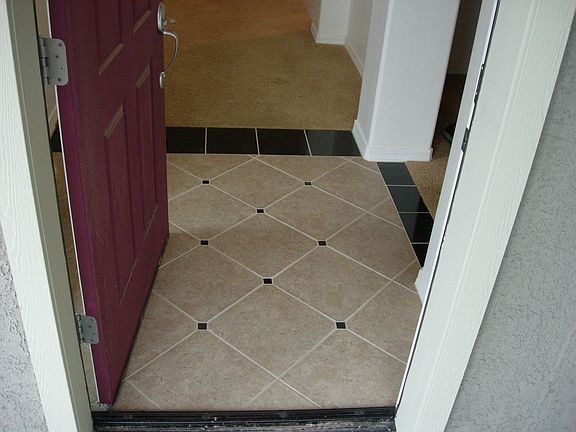 Custom Tiled Entry with Black Granite Accents