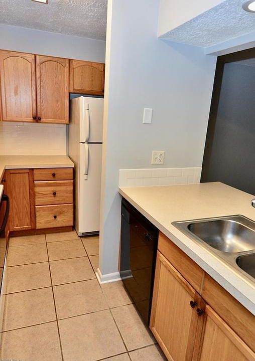 Kitchen with Stove, Refrigerator, Dishwasher, & Microwave.