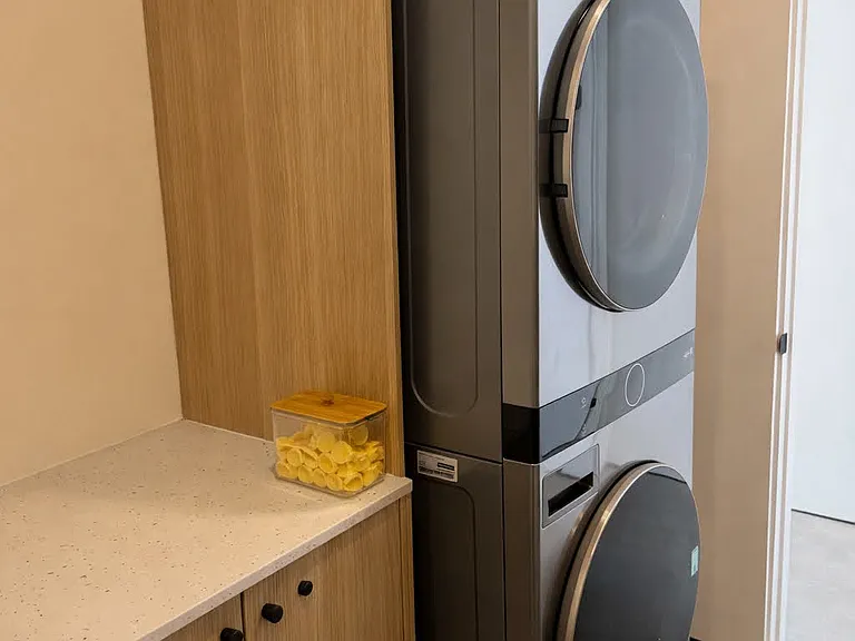 Convenient in-unit washer and dryer tucked neatly into a dedicated laundry space.