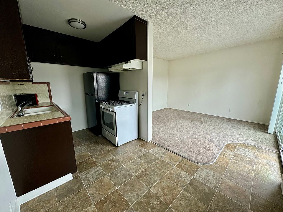 View from dining room into kitchen and living room
