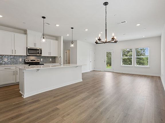 The open-concept floorplan allows for an easy flow between the kitchen and dining areas.