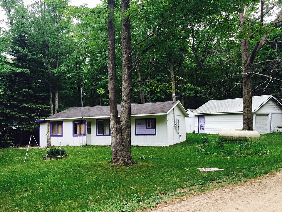 Great weekend place to go, needs updating, but very livable. 2 bedroom cabin near Grass Lake; many acres of state land near by for snowmobiling/4 wheeling and hunting. Two car garage has electricity is great for storing all of your toys.