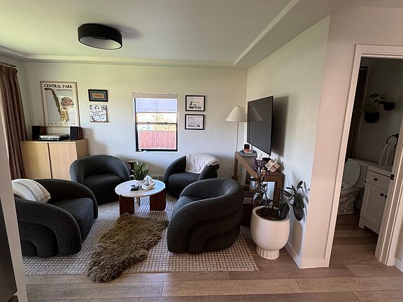 View from kitchen into living room, guest bathroom