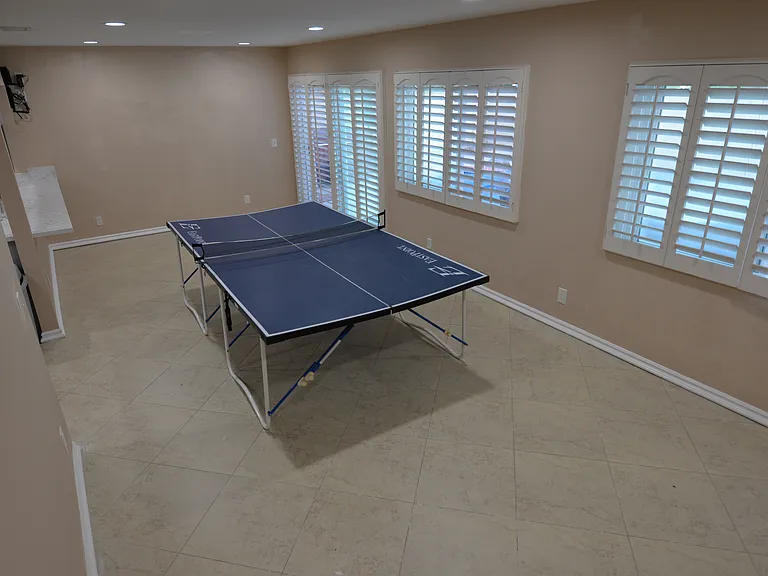 We filled this room with workout equipment when we lived here, with a nice pool view. The previous owner used this room as a second living room with couches, tv and desk.