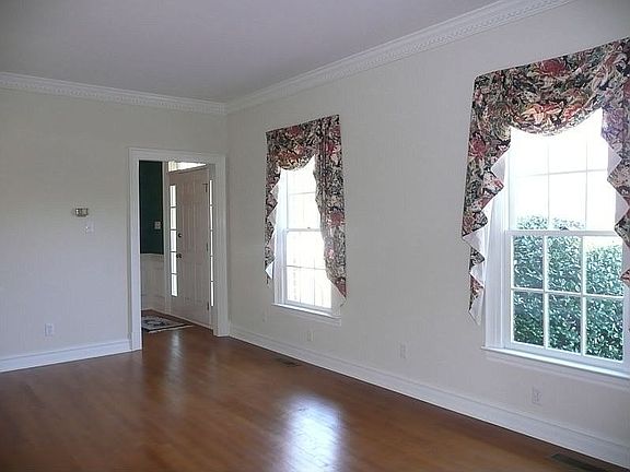 Formal Living Room w/ Detailed Trim, Beautiful Hardwoods & Great Natural Light