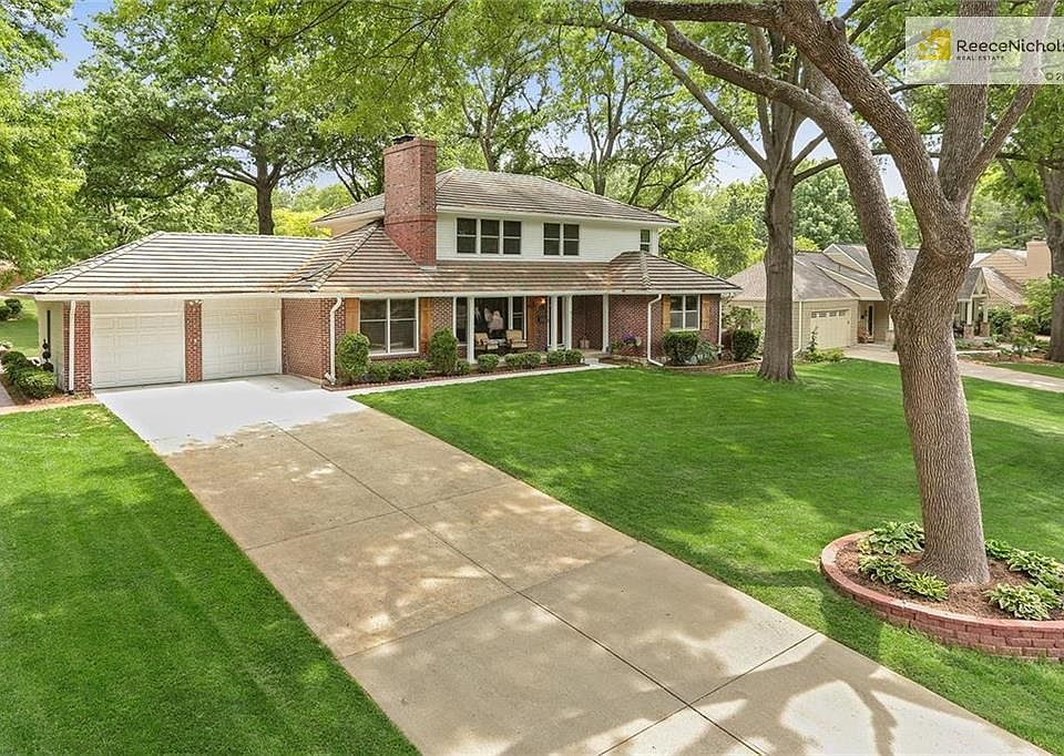 Newer exterior paint, sidewalk and driveway.  Elegant Leawood presentation.