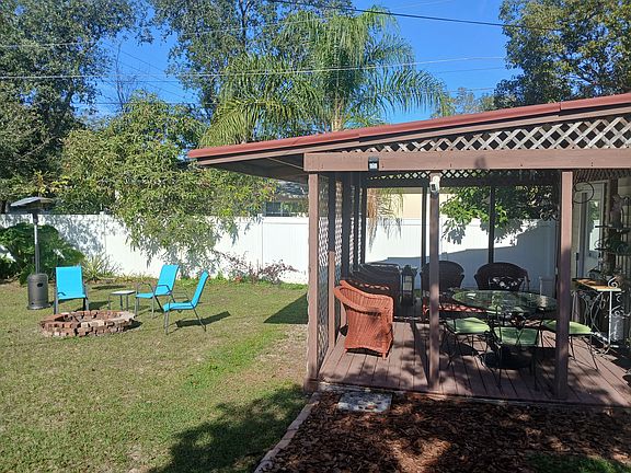 Deck and fire pit area in back yard.