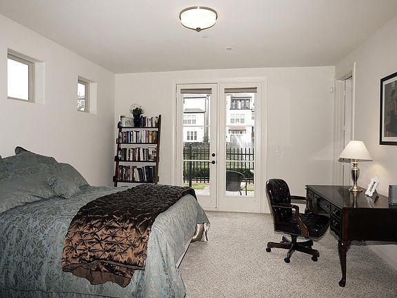 (16X14) This floor plan features a bedroom and bath on the first floor with double doors leading out to the downstairs patio.