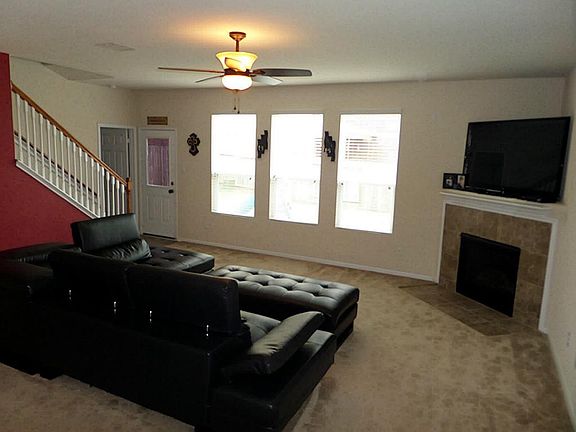 Welcoming living area greets you as you enter. Notice the gas fireplace there  to keep you warm on those chilly nights