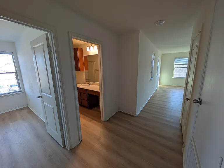 Upstairs - looking into a bedroom, bathroom and game room