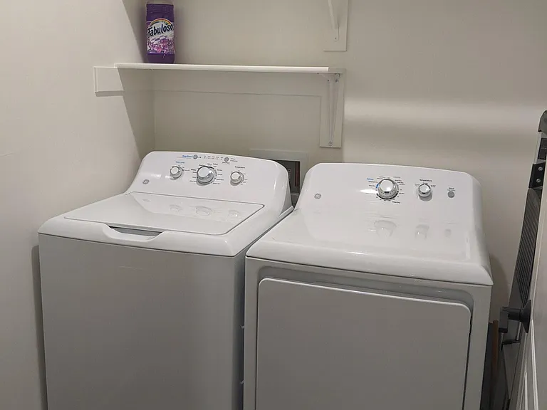 Laundry room with shelves. (Washer/dryer not included)