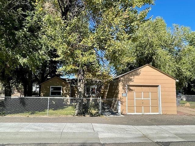 Front , fully fenced with garage