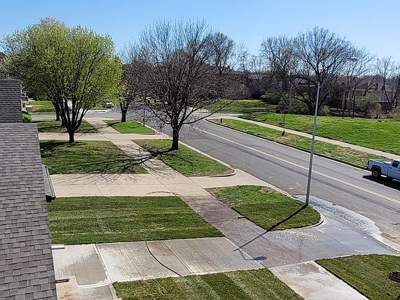 Everything is coming alive! Street view from upstairs window.