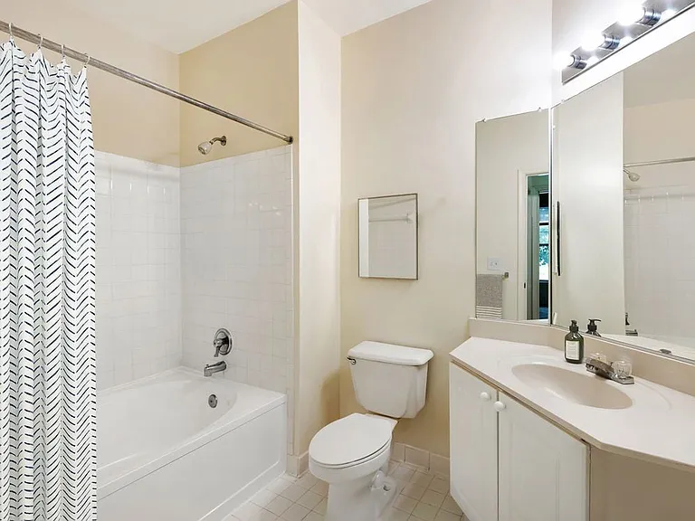 Classic Package I bath with white cabinetry, white laminate countertops, and hard surface flooring