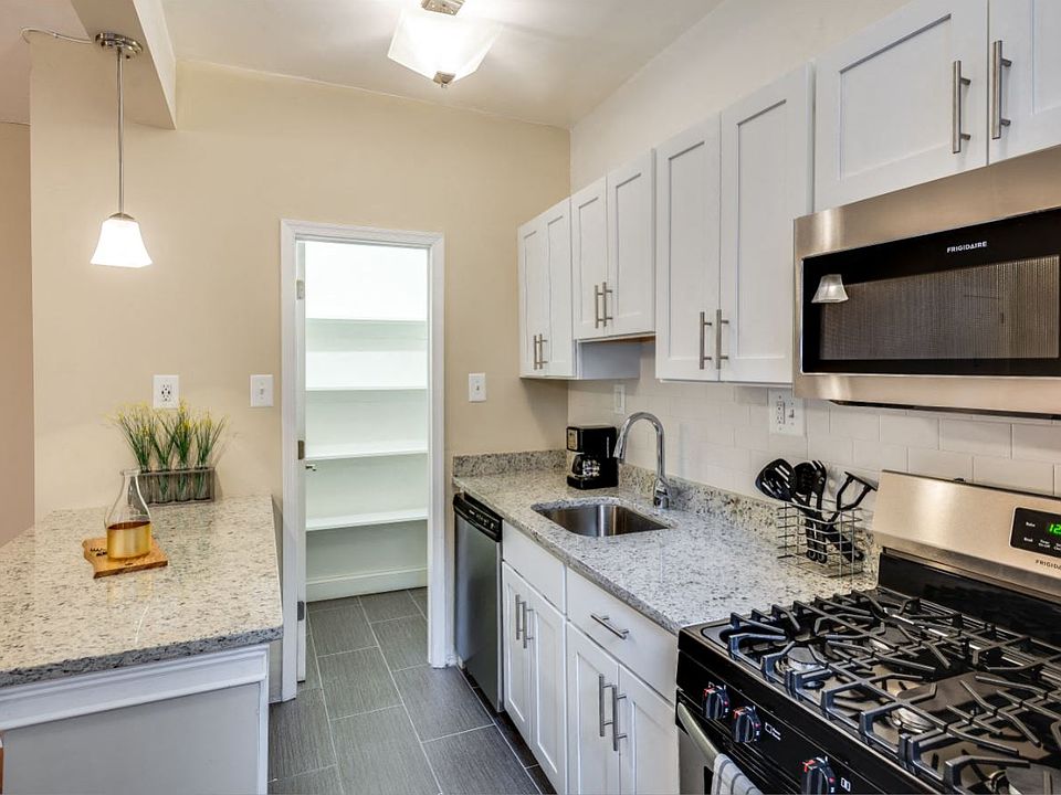 Renovated kitchen with stainless steel appliances and granite countertops