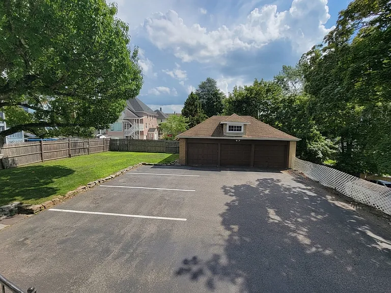 Fenced in Yard + Parking area behind house