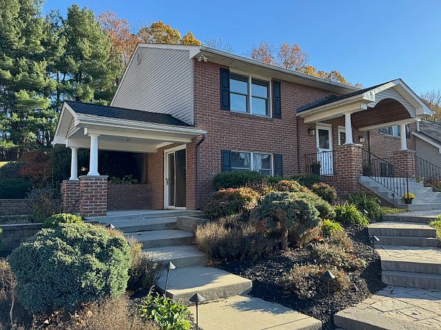 Exterior with front entrance and side patio