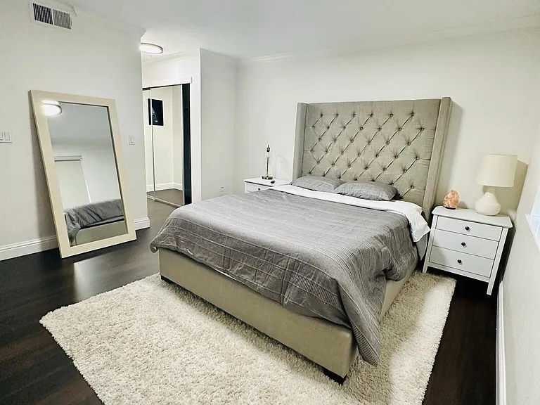 New queen sized bed, night stands, lighting, and tons of closet space!