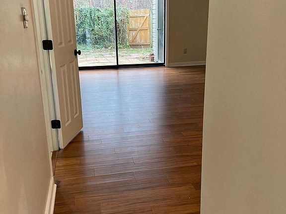 Family room with view of fenced in backyard.