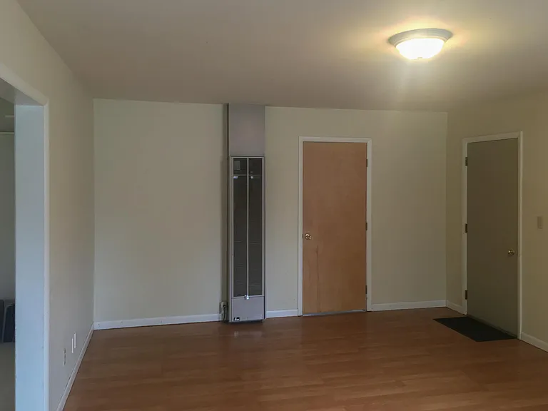 6310 FamilyRoom, door on the right goes to garage, extra gas furnace for this large family room, door on the left goes to laundry room/utility area.