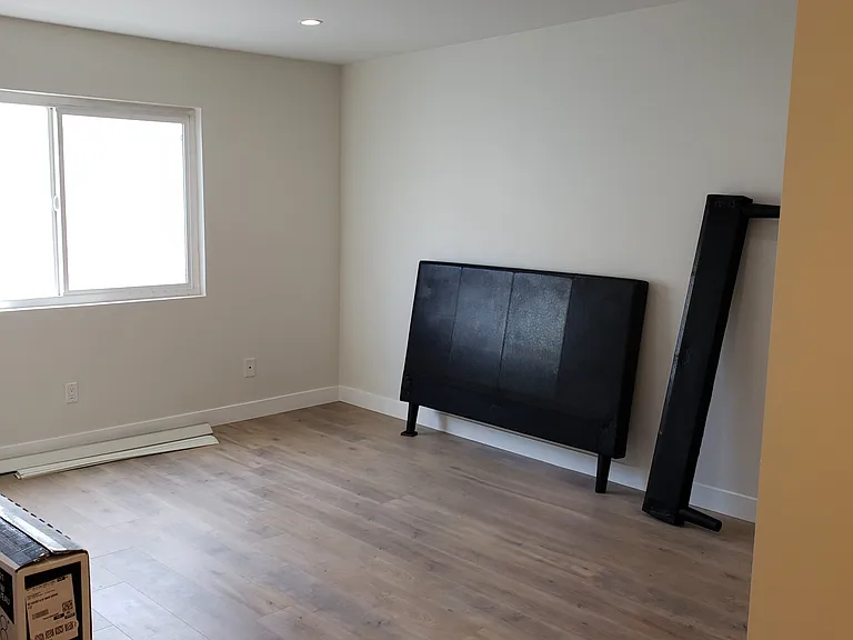 2nd Level - 1st Bedroom is spacious with walk-in closet; vanity/sink; laminate flooring, recessed lights. Bedroom has access to unit's own rooftop deck
