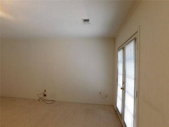 FRENCH DOORS IN SPACIOUS SECOND LIVING AREA.