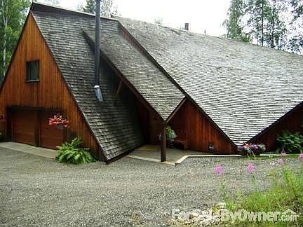 Post and Beam Architecture : North side of home, Front and garage entrance. New cedar shake roof.