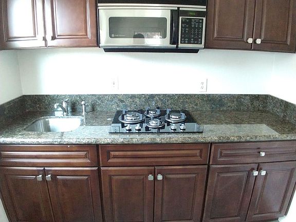 New countertops, cabinets, and 4 burner stovetop