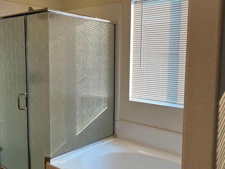 Master Bathroom #2 features a separate shower and bathtub, a vanity mirror, and dual sinks.