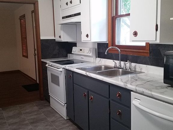 The cabinets have been refaced and kitchen has a pantry not pictured