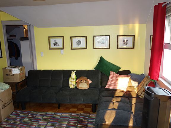 Nice spaced living room with views of the Space Needle from every window