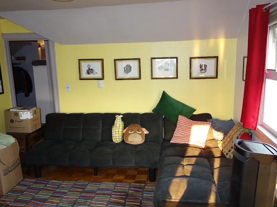 Nice spaced living room with views of the Space Needle from every window