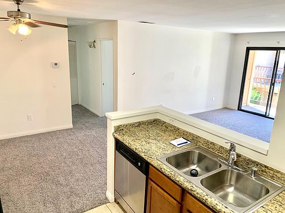 Dining and Kitchen area, new lighting in kitchen, ceiling fan, all new carpet, all stainless steel appliances, including a dishwasher