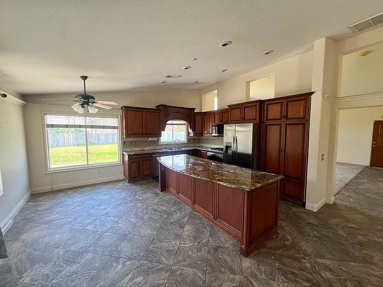 Kitchen with 4 seat island & dining area