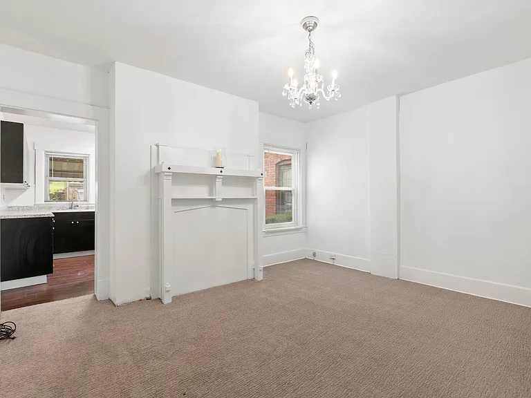 Dining Room with Built in Mantle over closed fireplace.