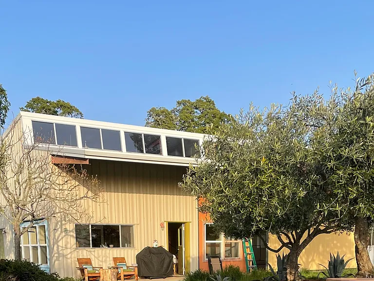 Front of house, faces garden and expansive views West.