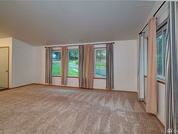 A large living room full of natural light. 