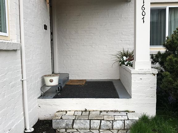 covered front porch with area for flowers or herbs