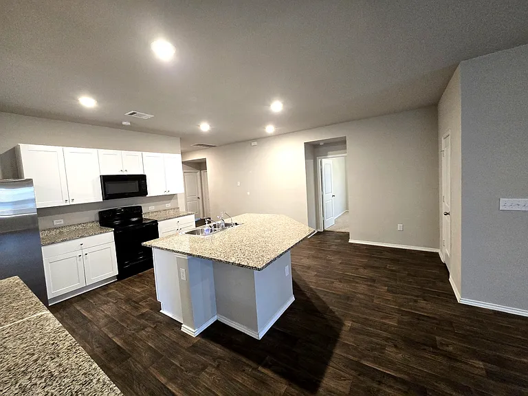Bright and functional kitchen layout with easy flow into living areas.