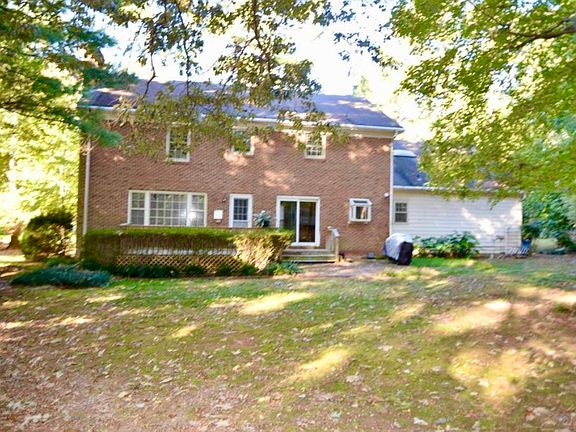 Back of house with large back yard