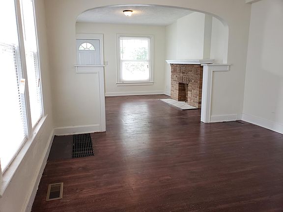 Dining and living room with large sunny windows