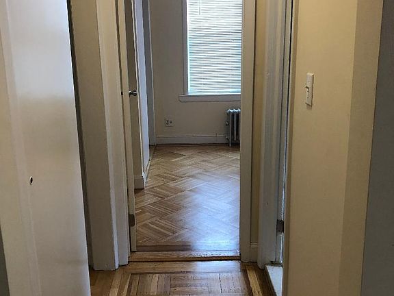 Corridor leading into the bedroom: On the left is a nice size closet and to the right is the bathroom