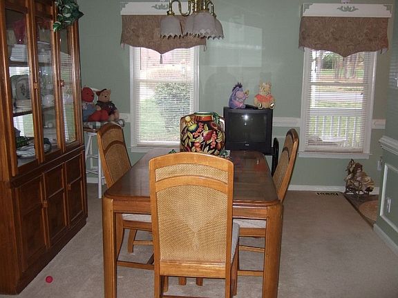 A formal dining room trimmed in picture,crown and chair molding,Custom colors
