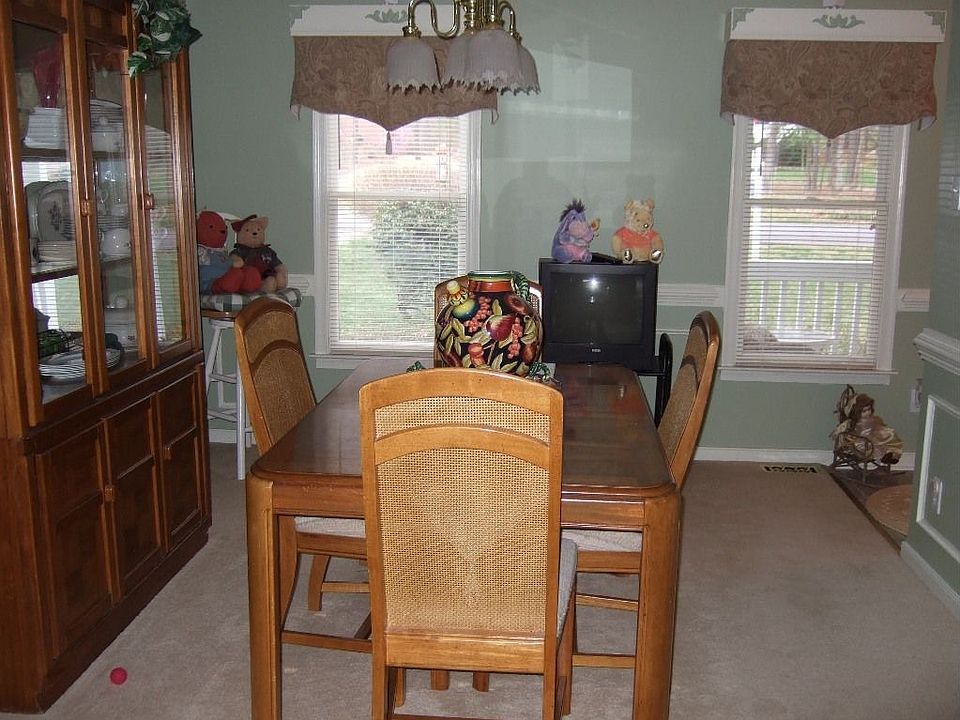 A formal dining room trimmed in picture,crown and chair molding,Custom colors