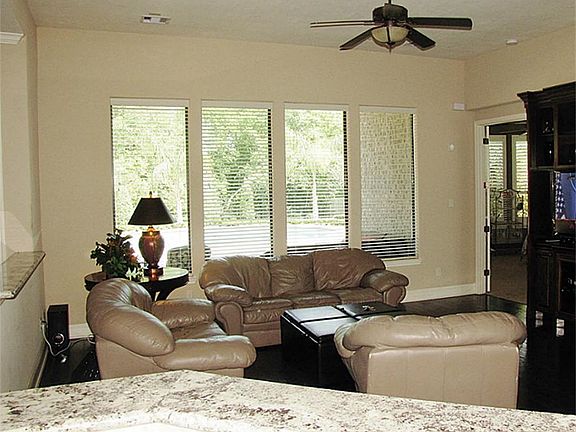 SECOND VIEW OF FIRST FLOOR LIVING - GREAT VIEW OF BACK YARD OASIS