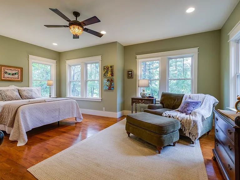 The second bedroom has a bathroom next to it. The bathroom also opens to the grand living room.