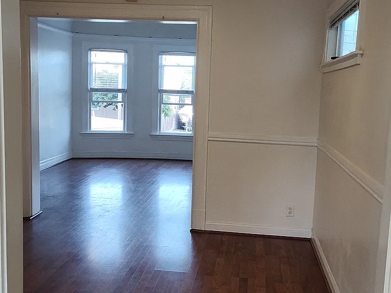 kitchen doorway looking at living room and dining room