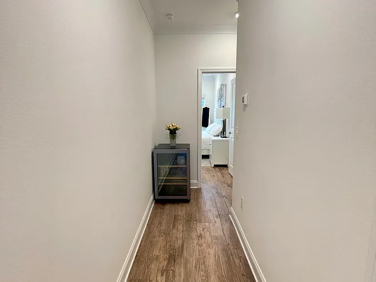 Downstairs hallway to two bedrooms and laundry room